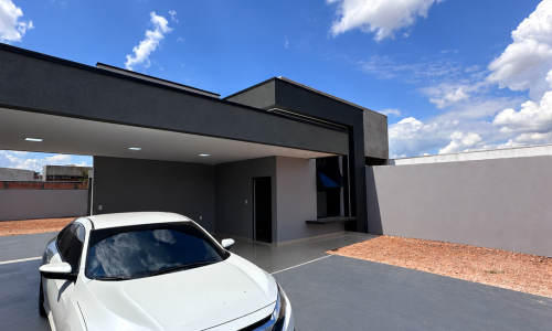 Casa moderna com Honda branca no jardim